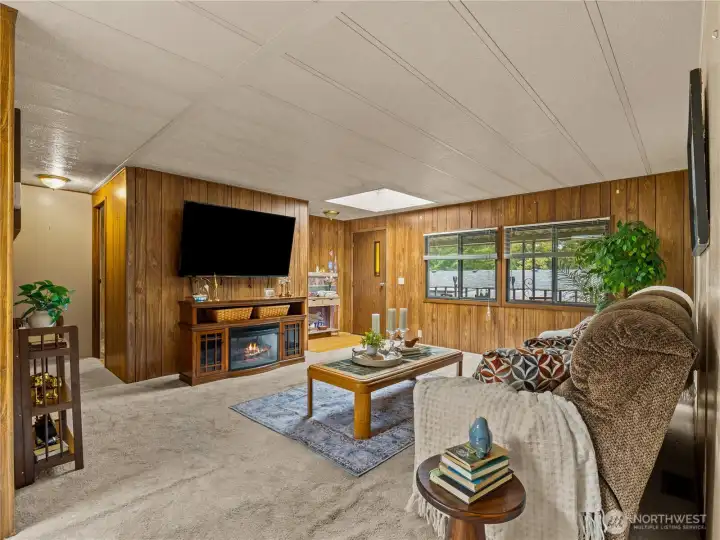 A large inviting living room for you to relax and entertain in.