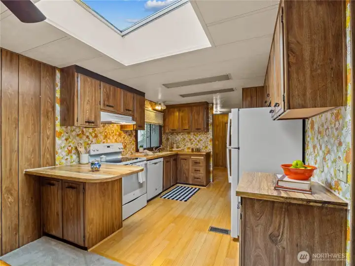 The galley style kitchen has a very efficient layout, conducive to cooking your favorite meals.