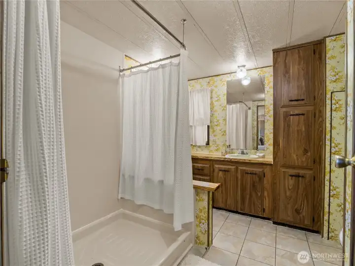 The large shower is newer and is made for long leisurely showers.