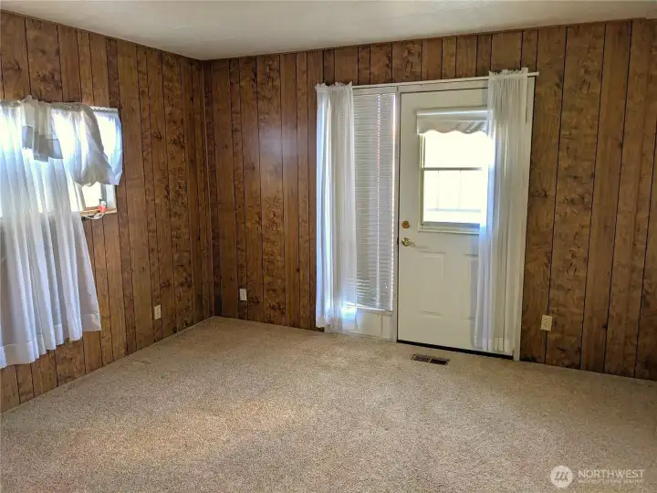 The Primary Bedroom has a door to a smaller porch and steps to the back yard. The wonderful view of the pond can be enjoyed any time. It also has an attached full bath.