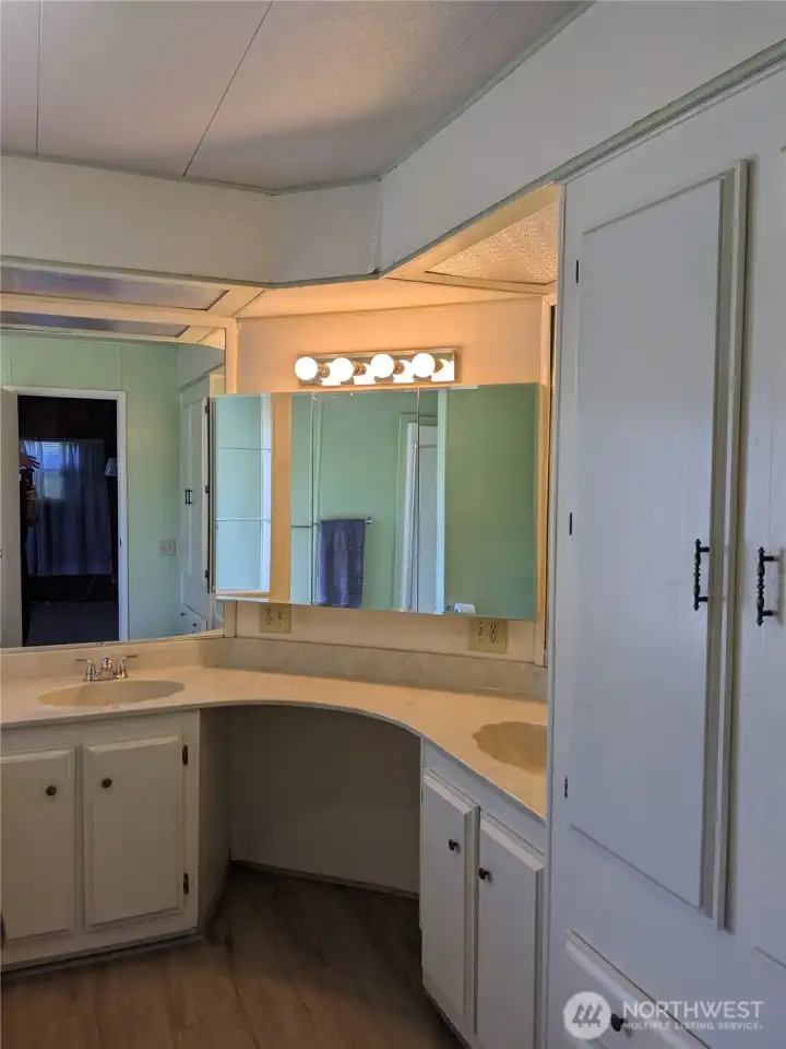 The Full Bath off of the Primary Bedroom has a Jacuzzi tub and Walk-in Shower