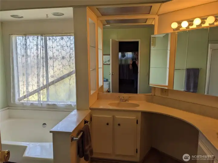 The Full Bath off of the Primary Bedroom has a Jacuzzi tub
