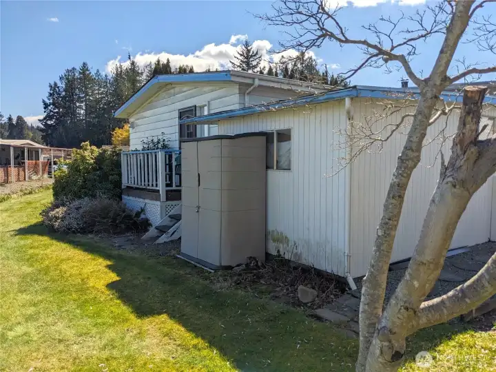 The back of the storage building and the home.