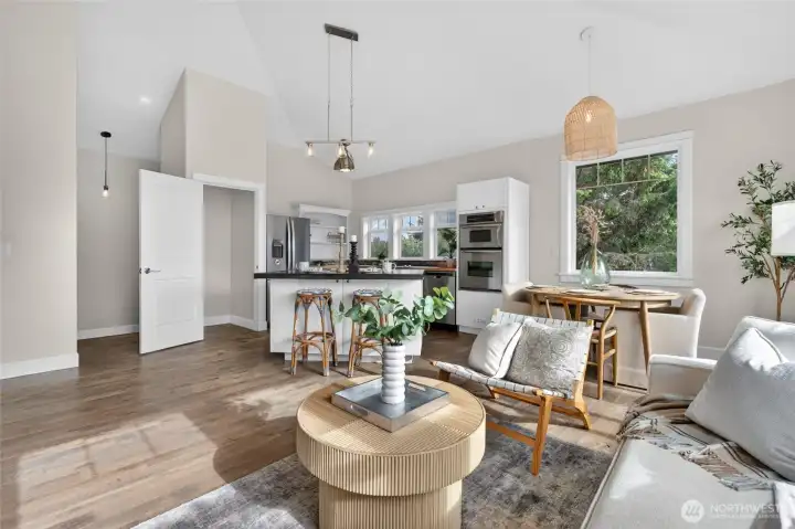 Experience the stunning vaulted great room. Combines a high-end chef's kitchen, dining nook, and bright living space.