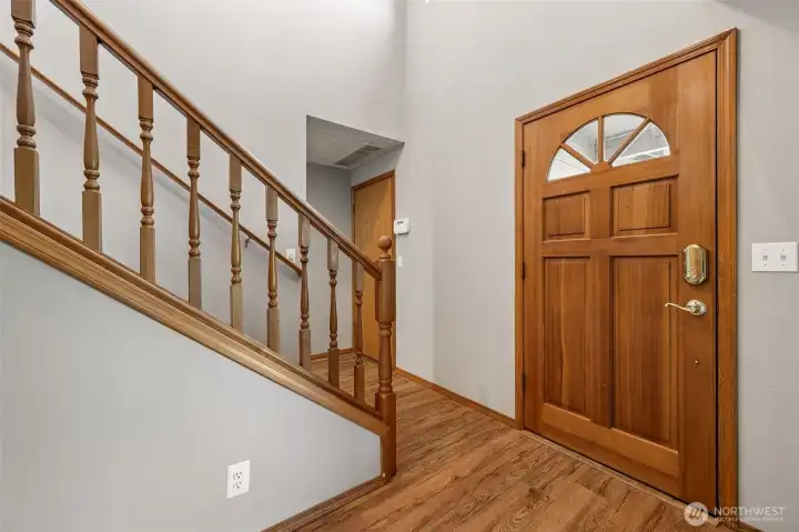 Formal entry with open staircase.door to the garage located in this hallway.