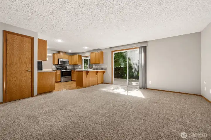 An incredible media room just off the kitchen with walk-out to the amazing backyard.