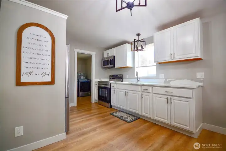Charming kitchen with updated finishes, stainless steel appliances, and a functional layout."