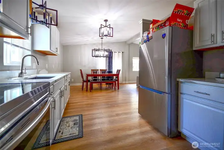 This view captures the kitchen's thoughtful layout, making meal preparation both easy and enjoyabl
