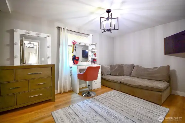 Comfortable primary bedroom with plenty of space for furniture and personal touches