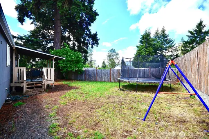 Spacious backyard offering plenty of room for outdoor living, entertaining, and relaxation