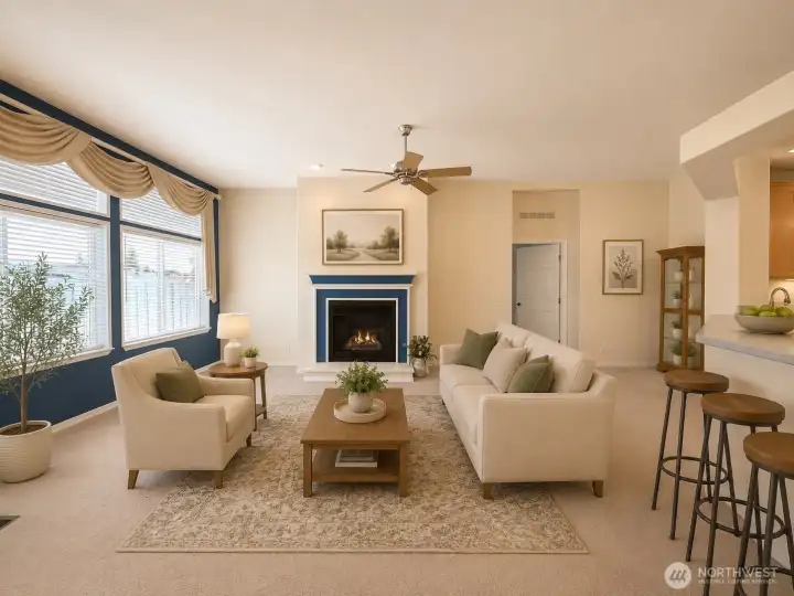 Living room features large windows for plenty of natural light and a gas fireplace Living room features large windows for plenty of natural light and a gas fireplace