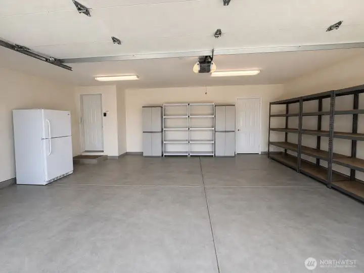 Large garage with door leading outside Large garage with door leading outside