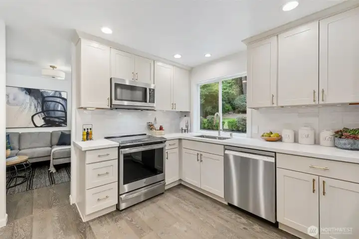 Updated kitchen with new SS appliances, countertops, and fixtures. Updated kitchen with new SS appliances, countertops, and fixtures.