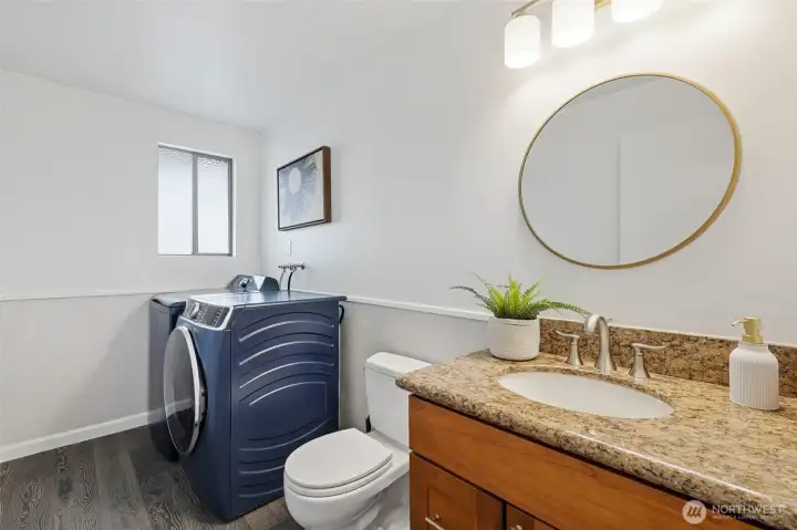 Laundry and 1/2 bath conveniently off the kitchen and dining area. Laundry and 1/2 bath conveniently off the kitchen and dining area.