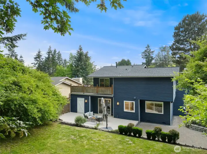Back of home showing newer roof, rooftop deck, entertaining areas, and lawn Back of home showing newer roof, rooftop deck, entertaining areas, and lawn