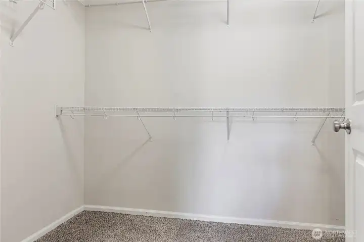 Primary walk-in closet. Primary walk-in closet.