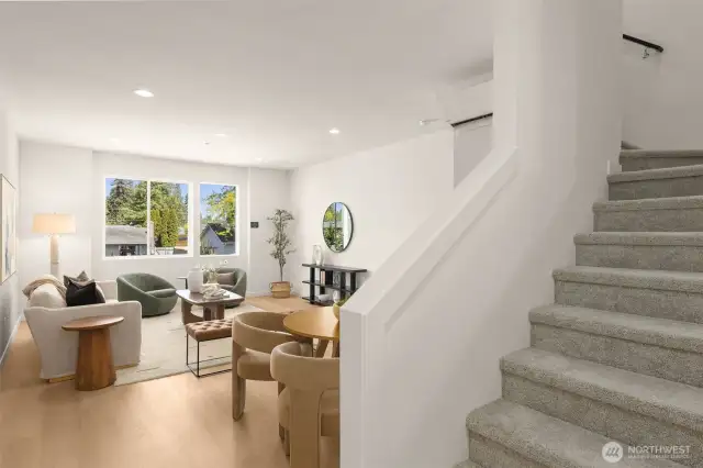 Gather, dine, and create memories in this expansive main level. The seamless flow from this model home's space make entertaining a breeze. Sliding doors connect you to outdoor tranquility.