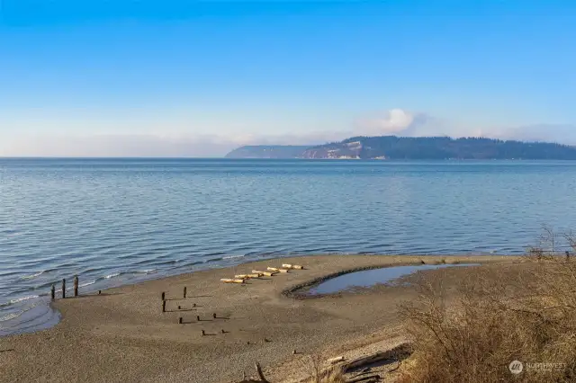 A serene beachside view offers a peaceful escape just moments away from the home.
