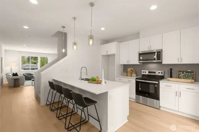 Create culinary masterpieces in this bright and inviting kitchen! With an oversized island and bar seating for casual mornings or lively cooking conversations.