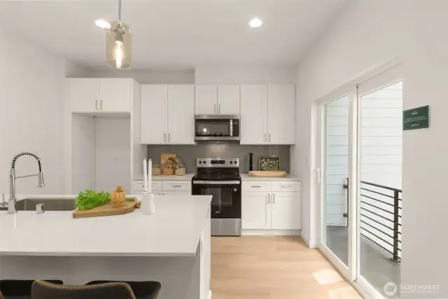 The open layout flows effortlessly into the dining area, perfect for hosting dinners or enjoying the view outside.