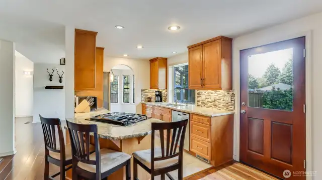 The thoughtfully designed peninsula provides space for a couple of bar stools, perfect for casual dining or entertaining.