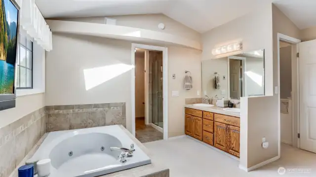 En-suite bathroom has dual sinks and plenty of cabinet storage.