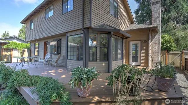 This low-maintenance wrap-around Trex deck is clean, functional, and ready for year-round relaxation and entertainment.