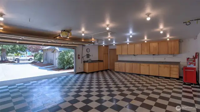 Detached 24' x 30' garage with heat, compressed air system, tiled floors & an abundance of cabinetry for all your storage needs.