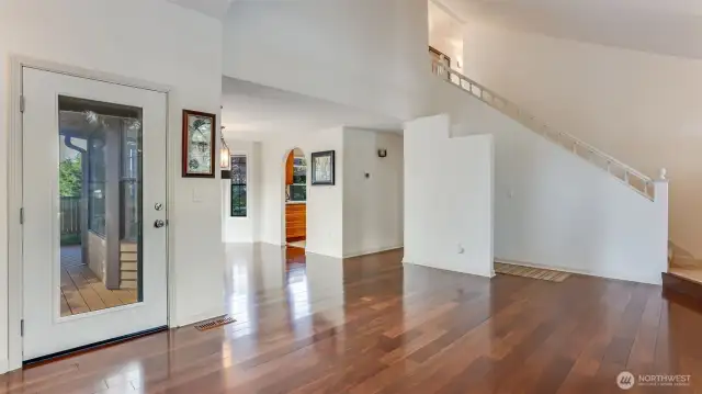 This perspective showcases the home's seamless flow, bedrooms and additional bathrooms are located upstairs.