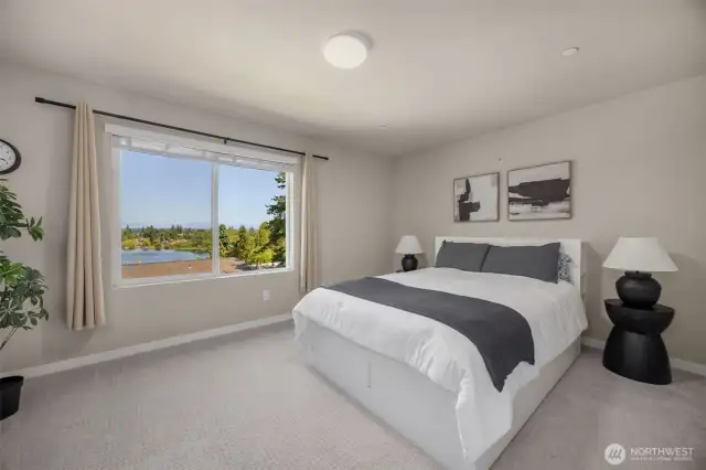 Primary bedroom overlooks Martha Lake and Cascade mountains