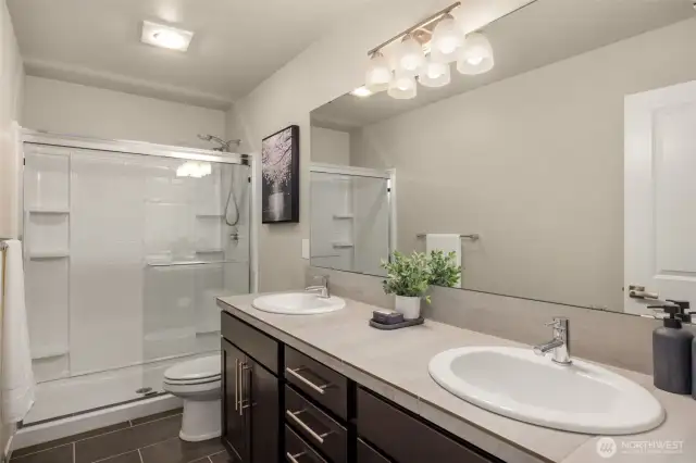 Dual sinks in primary bathroom and shower