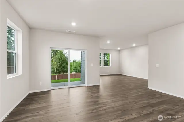 Great room design with covered patio off dining room.