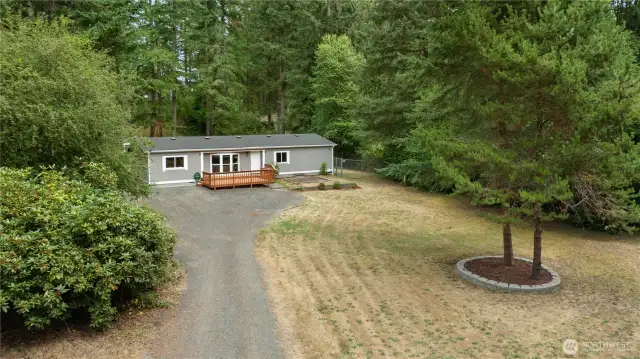 Spacious and wooded lot with room to park and fully fenced back yard!