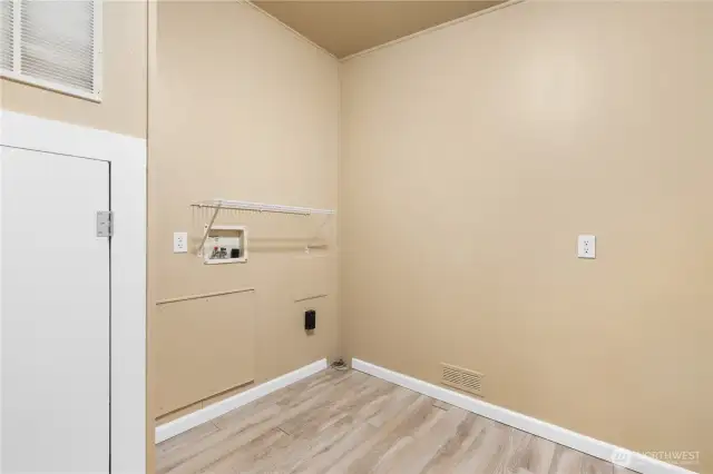 Utility/Laundry room with access to backyard