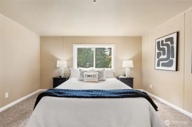 Primary bedroom is situated on one side of the home with additional beds on the other!