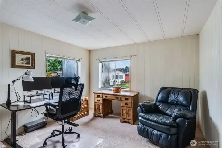 Flexible room with dual windows works perfectly as a cozy office, craft room or guest retreat.
