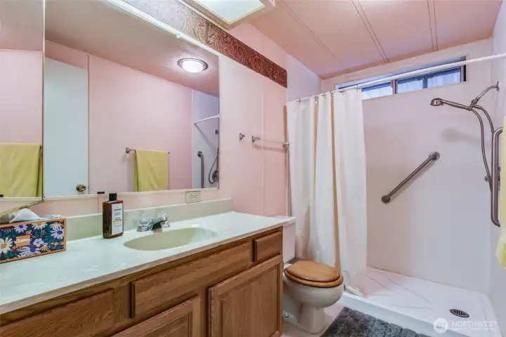 Cute Guest bathroom with walk in shower.