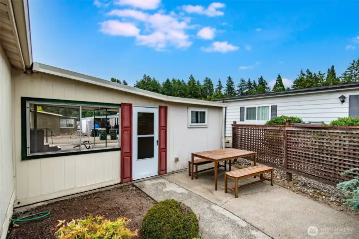 Private outdoor seating area is perfect for enjoying coffee, fresh air, or quiet moments.