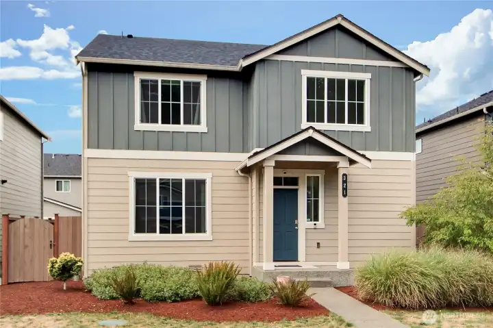 Outside view of home, refreshed landscaping front and back.