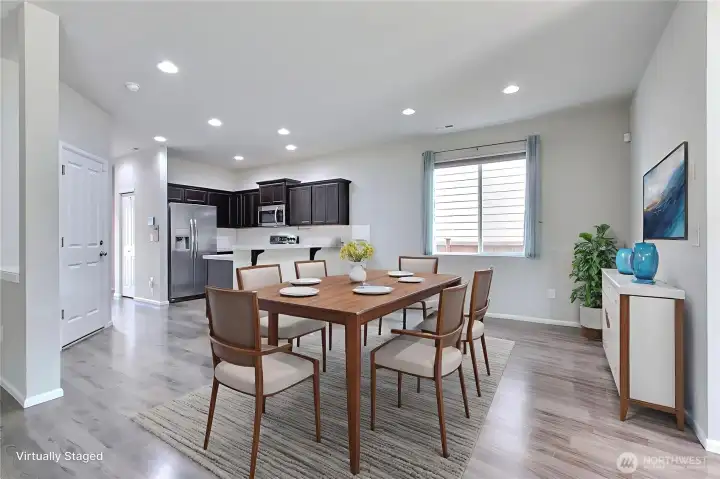 As you enter, down the hall to the right is your dining area. The open concept design really works for this home. ***Virtually Staged***