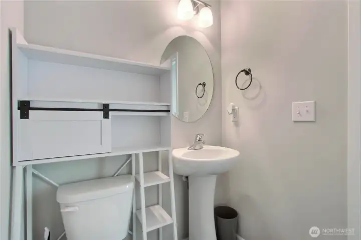 First floor powder room, down the hall from the kitchen by the back door.