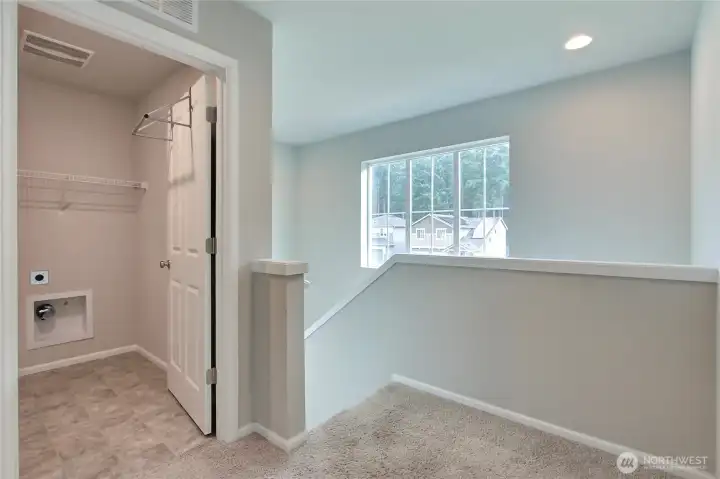 Upstairs landing view, I love the large windows and also that the utility room is up!