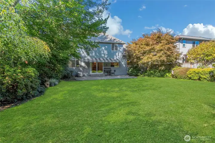 A gardener's dream of a back yard with great privacy and tons of mature landscaping