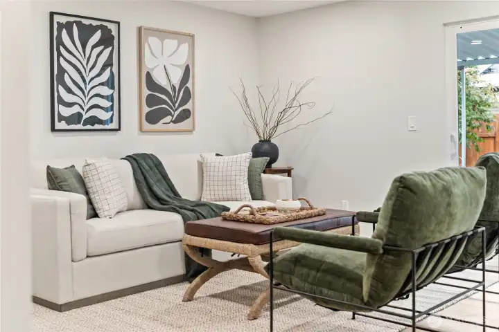 Spacious Living Room off of Kitchen w/ access to back covered patio!