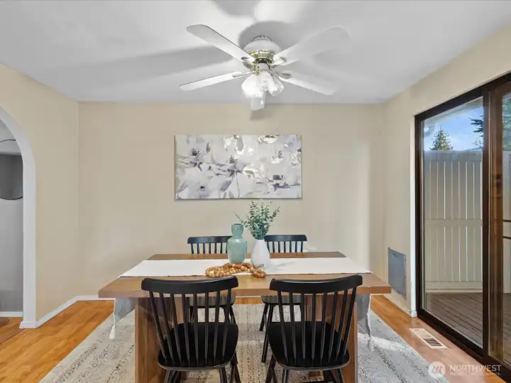 Gracious, open dining room includes doors to the covered deck.