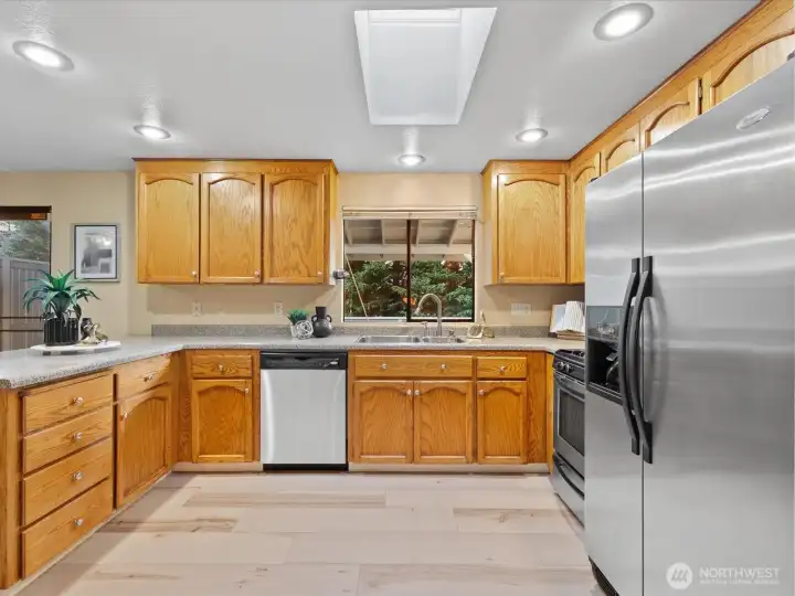 Additional kitchen features are the skylight and well placed inset lighting. This creates friendly, easy to use work space.