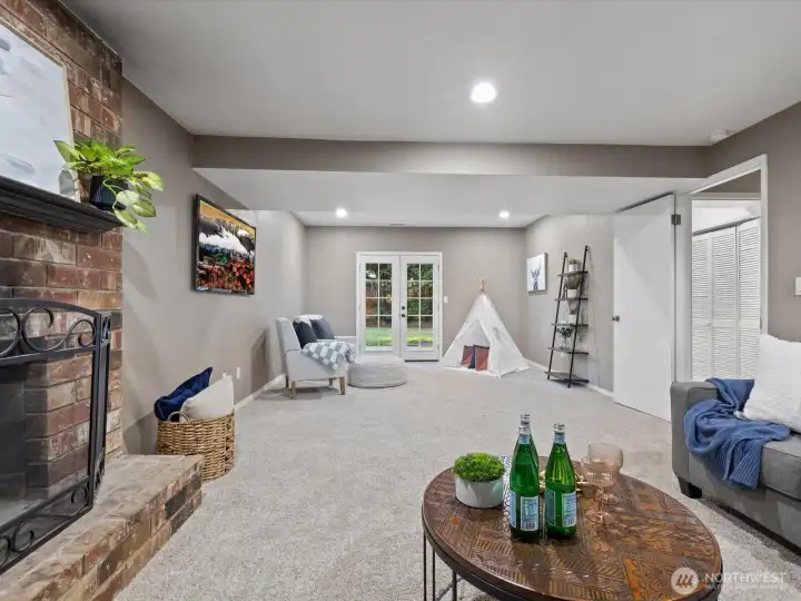 There is room here for entertaining, relaxation, play. French doors lead to the backyard patio.