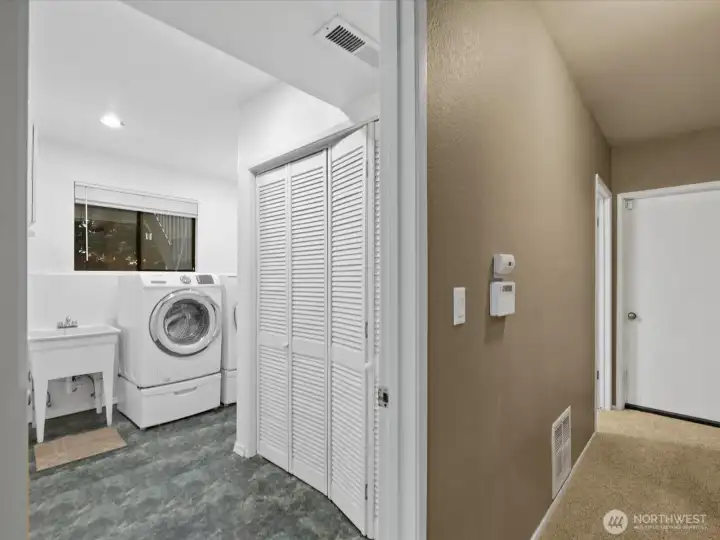 The closet in this space holds the natural gas water heater and furnace. There is an additional storage closet across the hallway.