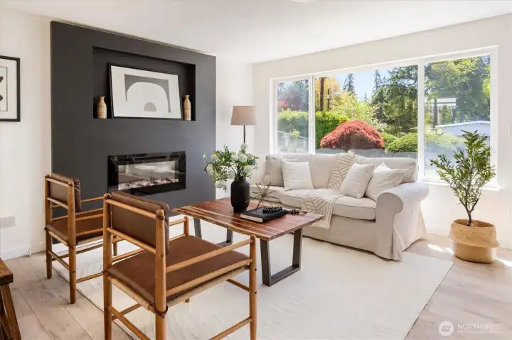 Light-filled living space with generous windows and flexible furniture placement options. Image from earlier listing in Sep 2025.