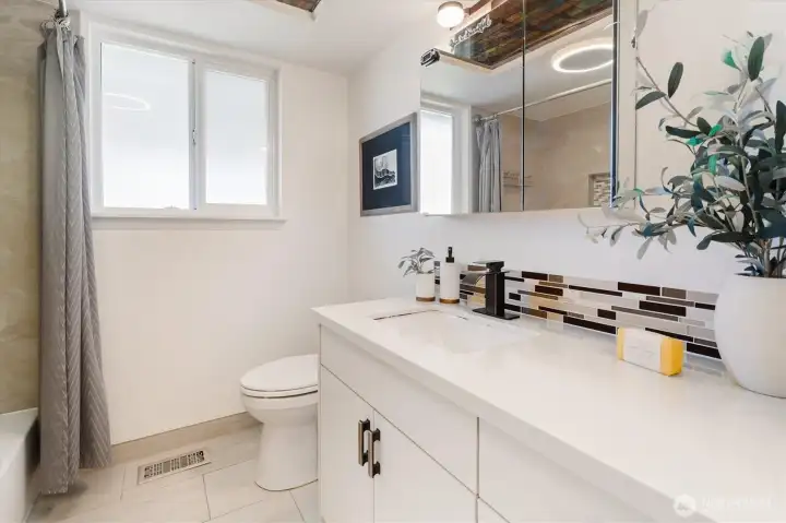 Updated bathroom with clean finishes and practical storage. (Image from earlier listing in Sep 2025.